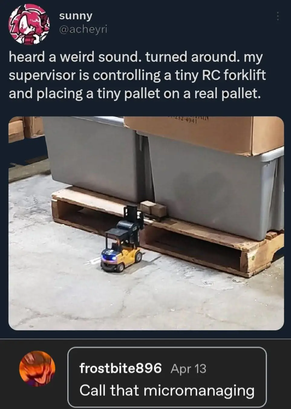 A small yellow remote-controlled forklift is shown maneuvering near a large wooden pallet holding big gray bins. The…