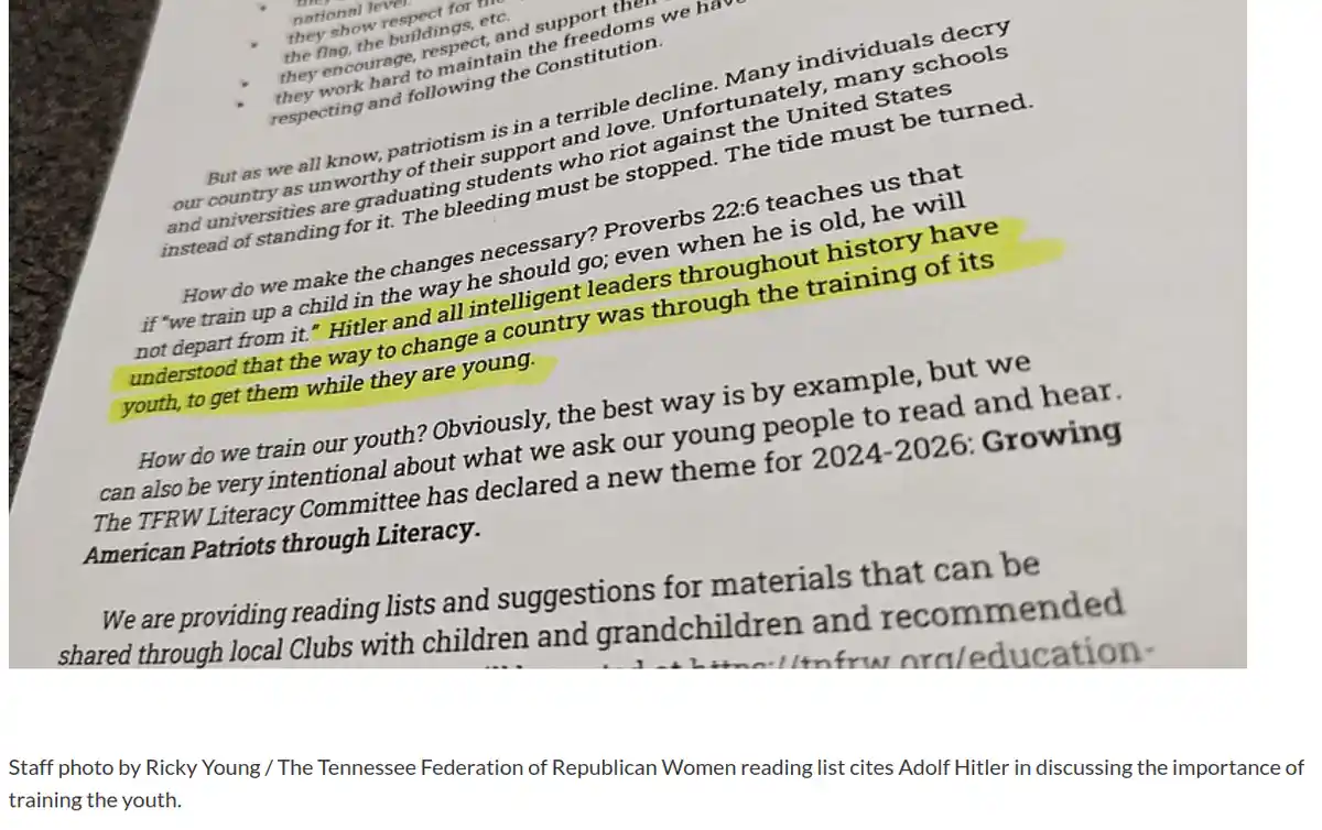 A close-up photo of a printed document with a paragraph highlighted in yellow. The highlighted text reads: 'Hitler and all…