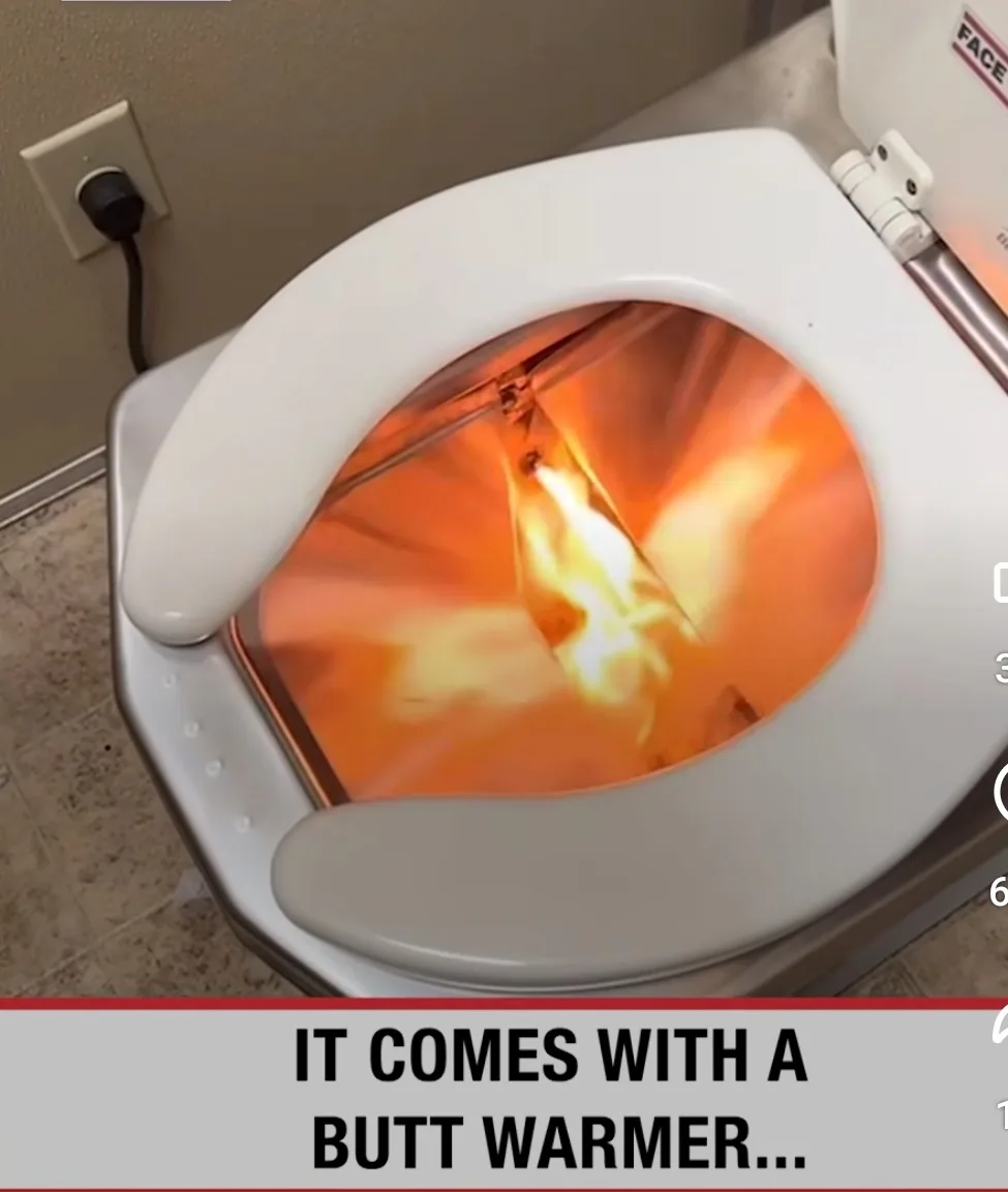 A close-up shot of a white toilet with its lid open, revealing a glowing orange and yellow flame inside the bowl. The toilet…