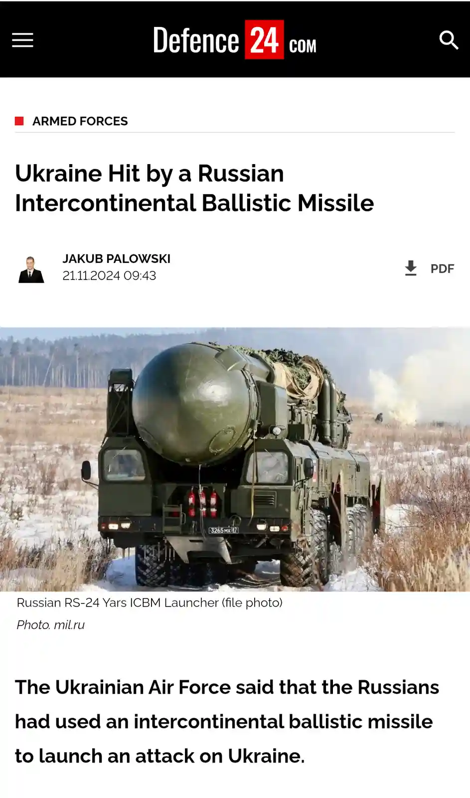 A screenshot of a Defence24.com news article shows a large Russian RS-24 Yars ICBM launcher on a snowy field, with the…