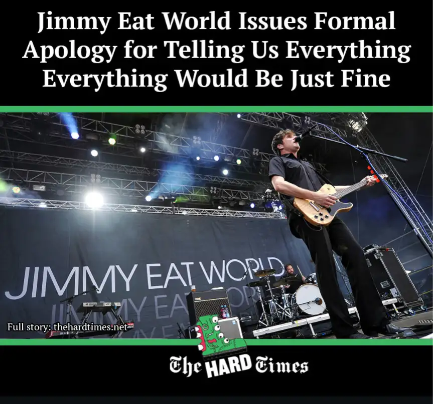 A musician from Jimmy Eat World performs on stage with a guitar, under bright stage lights and a backdrop with the band's…