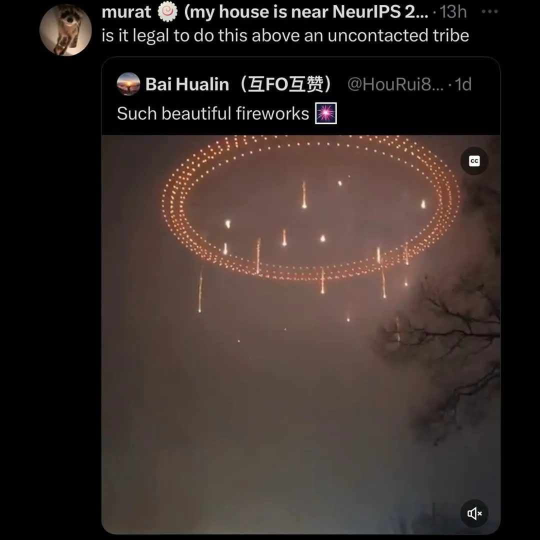 A screenshot of a social media post showing a drone light show forming a large, glowing circular pattern in the night sky…