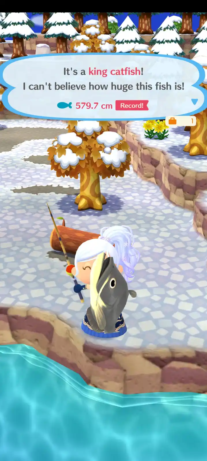 A character from Animal Crossing holds a massive fish, with a game notification above declaring it a 'king catfish'…