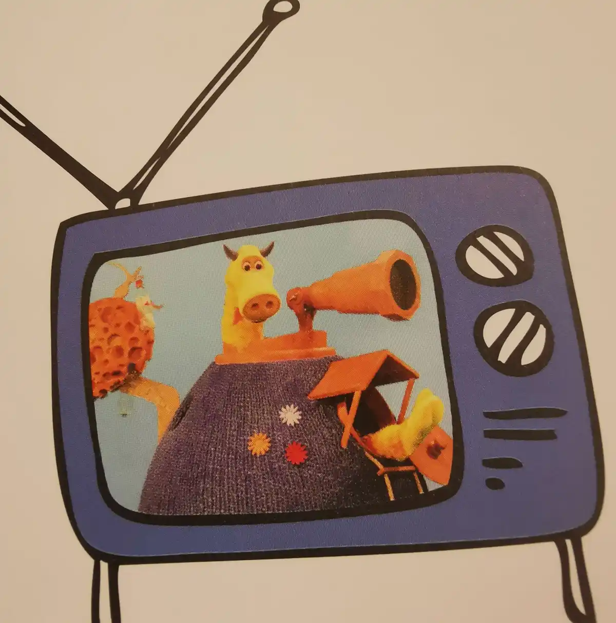 A cartoon illustration of a vintage-style television set with two antennas and dials, displaying a scene from the children's…