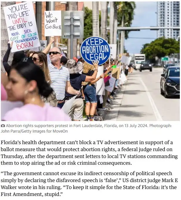 A protest scene shows people holding signs, one large blue sign reads 'KEEP ABORTION LEGAL', and another sign says 'YOU'RE…