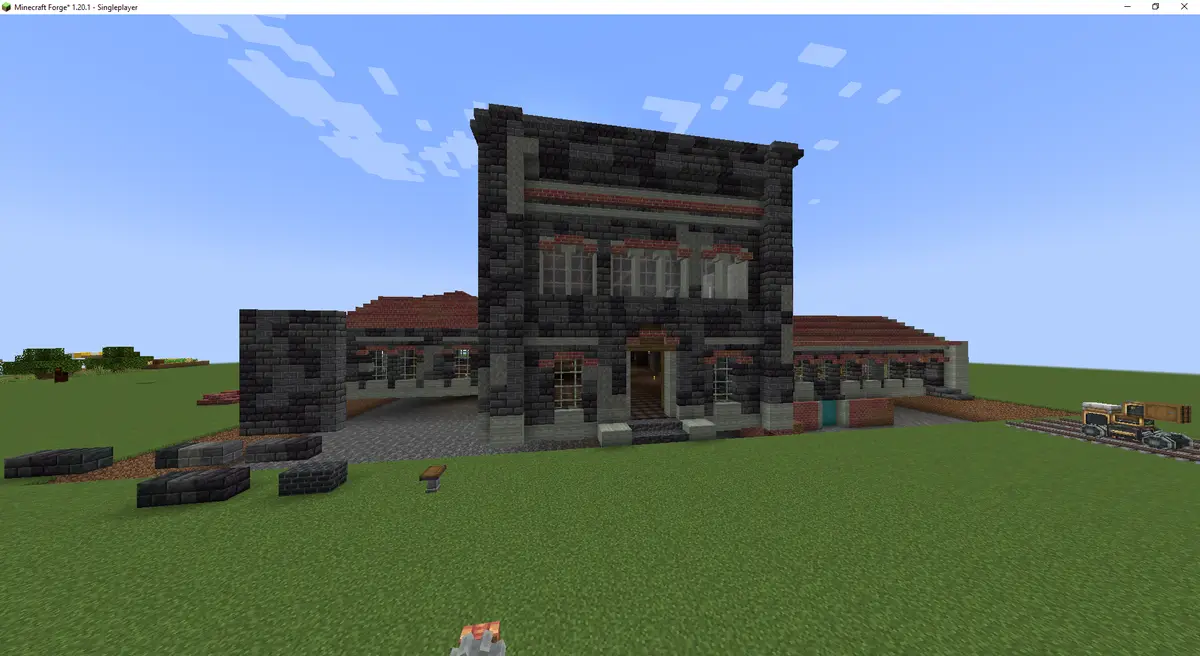 A screenshot from the game Minecraft shows a large, detailed stone and brick building with multiple windows and a central…