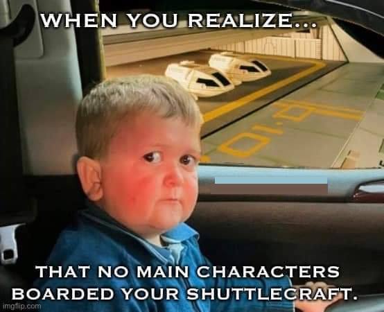 A young boy with a pensive, slightly disappointed expression sits in a car, looking out the window at a futuristic…
