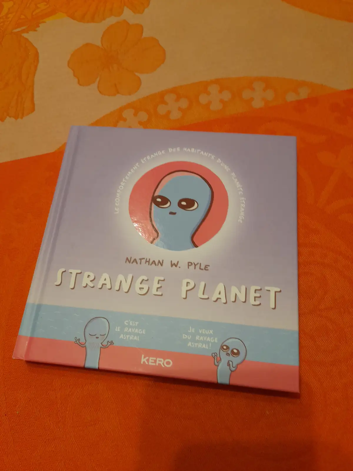 A children's book titled 'Strange Planet' by Nathan W. Pyle, featuring a blue alien character on the cover. The book is…