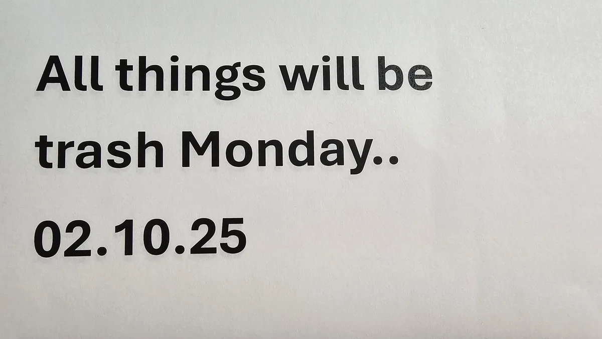 A plain white wall displays bold black text stating 'All things will be trash Monday..' followed by the date '02.10.25'. The…