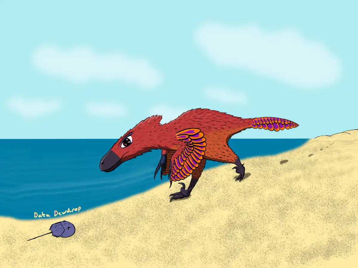 A cartoon red feathered dinosaur with purple and orange wing-like feathers stands on a sandy beach near the ocean, looking…