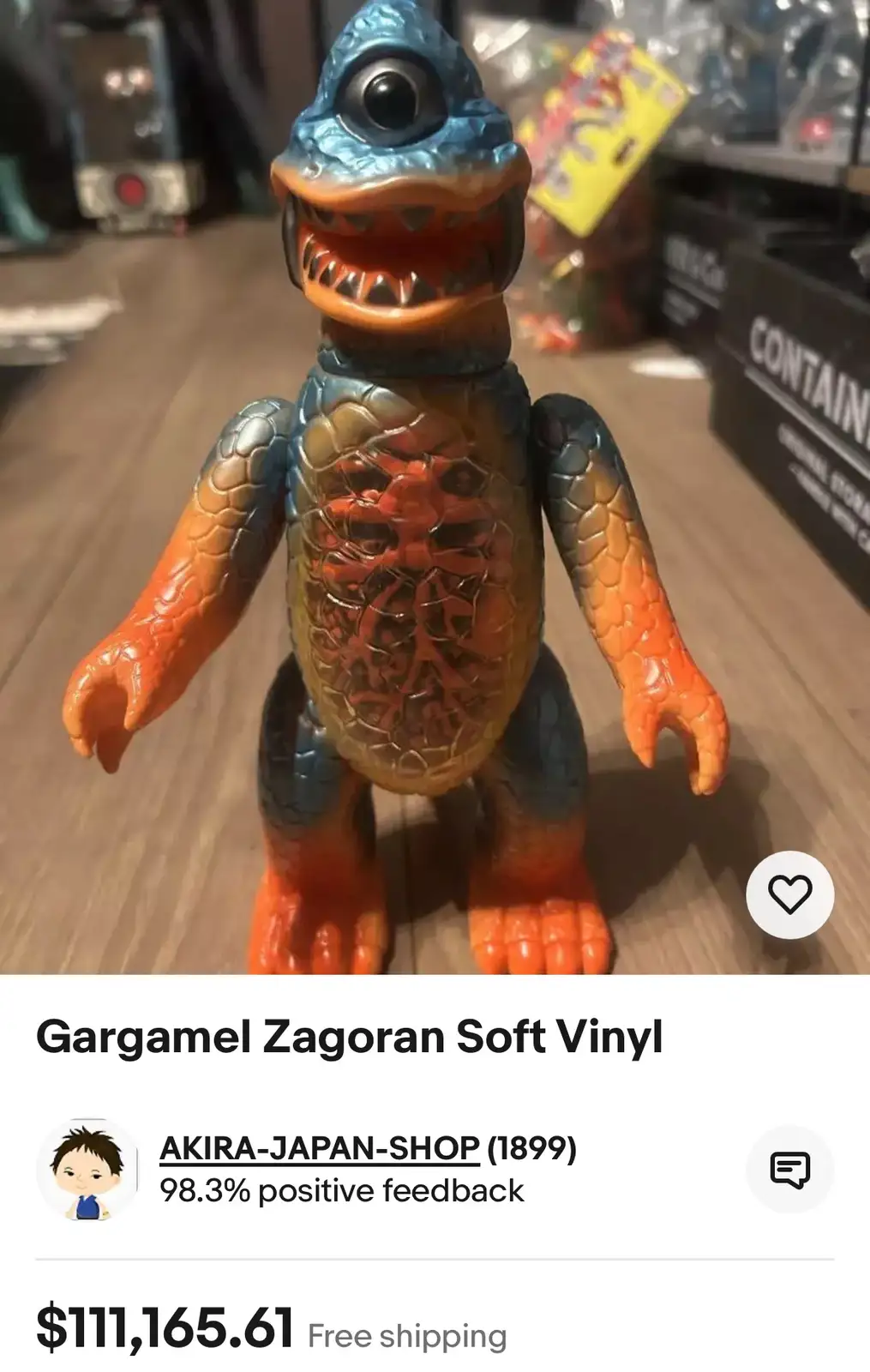 A close-up photo of a colorful, reptilian monster toy with a blue head, orange limbs, and a textured torso, displayed on a…