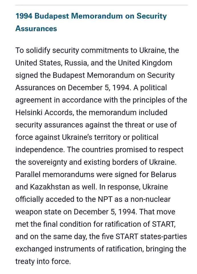 The image displays a plain white background with dark blue text detailing the 1994 Budapest Memorandum on Security…