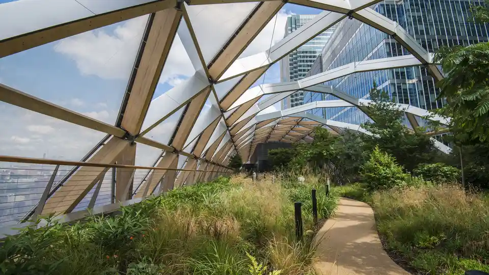 In London's Canary Wharf, a rooftop garden near the Crossrail Place station offers a peaceful escape from the city bustle…