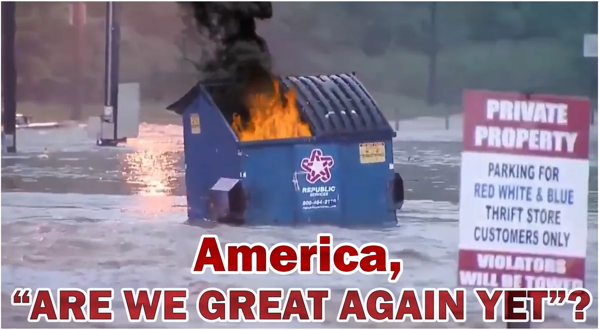 A blue Republic Services dumpster is on fire with black smoke rising, partially submerged in floodwater. To the right, a…