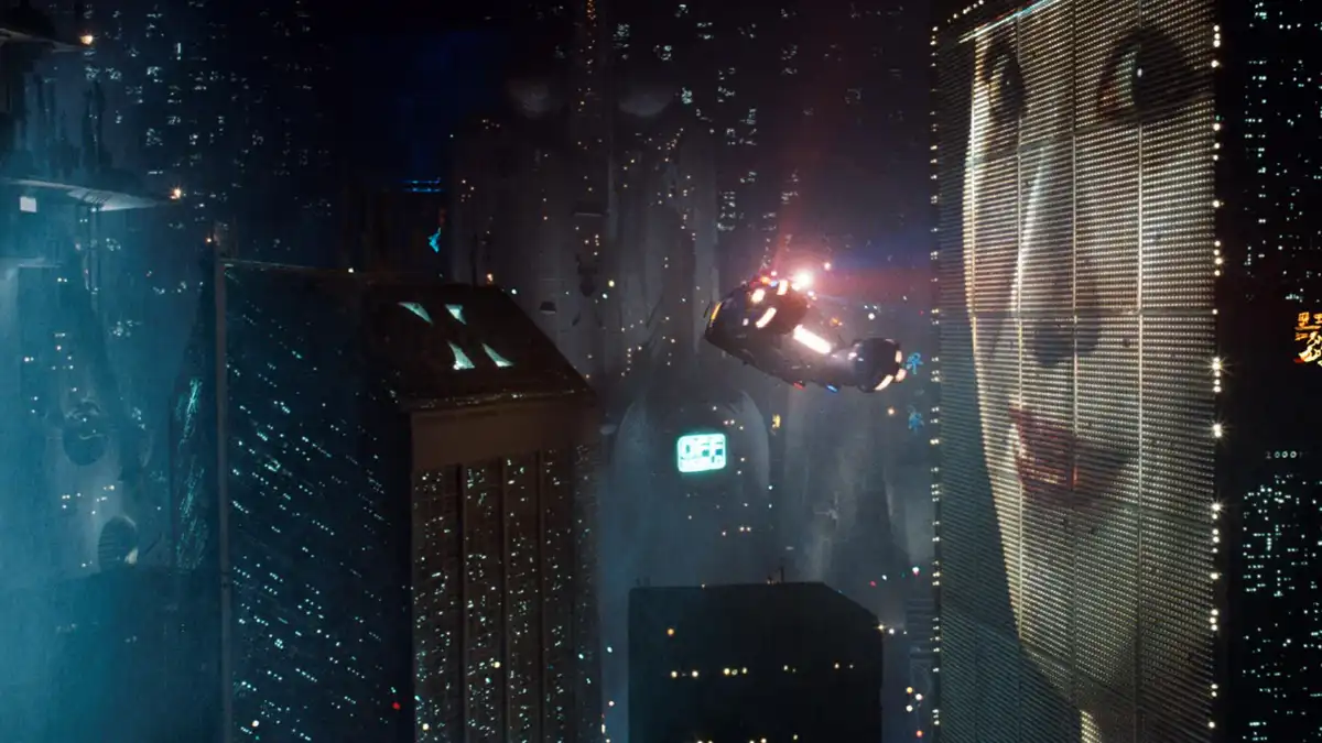 A futuristic flying vehicle navigates between towering skyscrapers in a neon-lit, rain-slicked cyberpunk city at night. The…