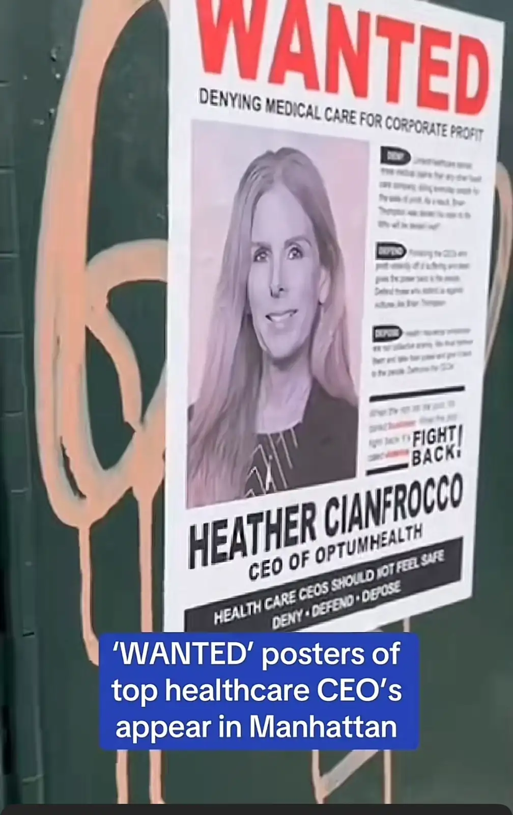 A 'WANTED' poster features a photo of Heather Cianfrocco, CEO of OptumHealth, with text accusing her of denying medical care…