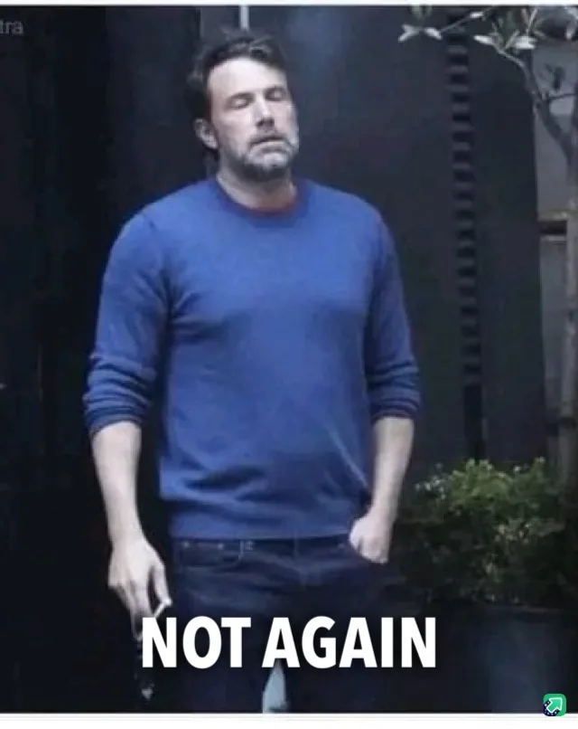 A man in a blue sweater stands with his eyes closed and head tilted back, looking exasperated or resigned. The text 'NOT…