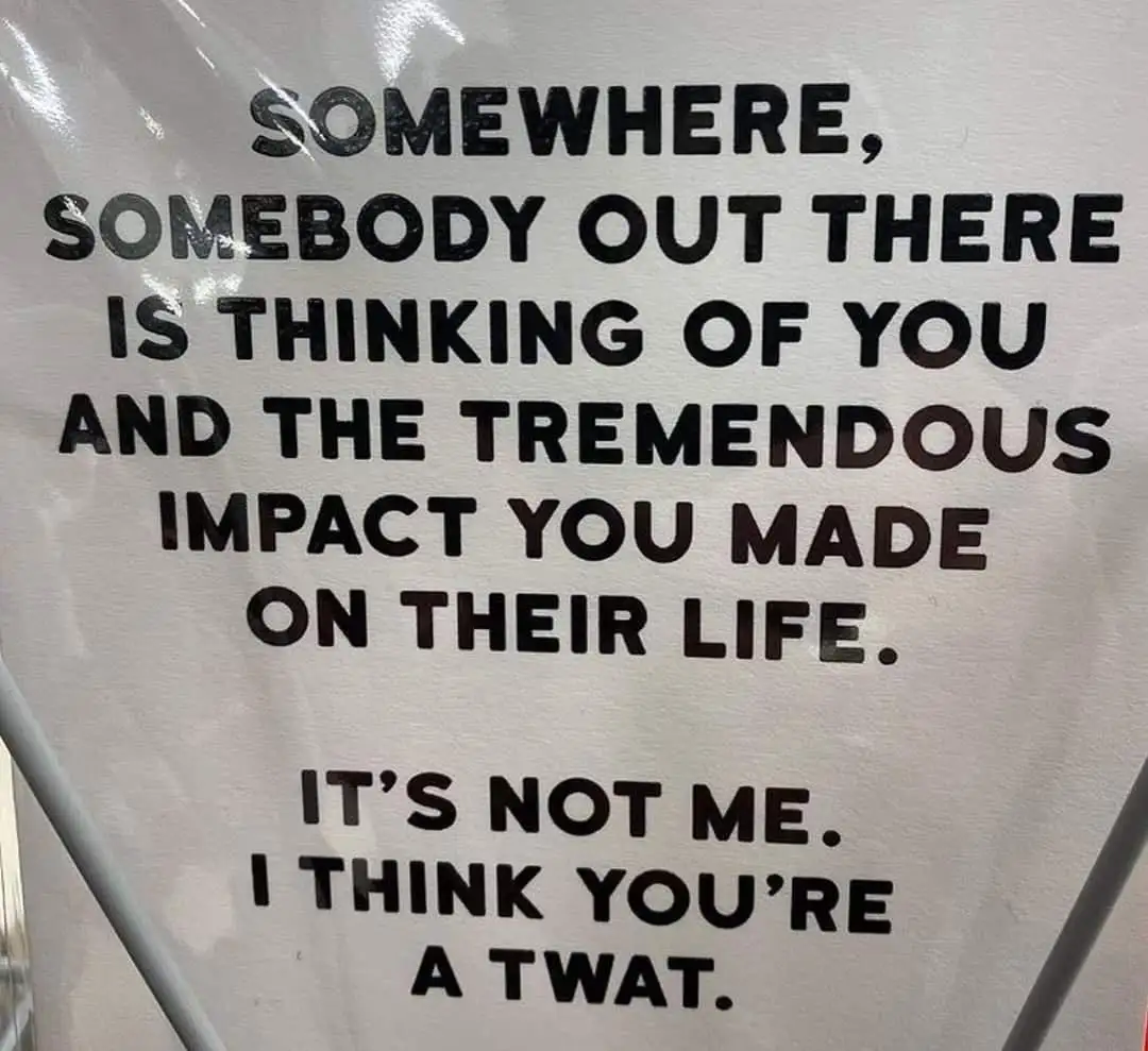 A white sign with bold black text reads a sentimental message about someone being thought of positively, followed by a…