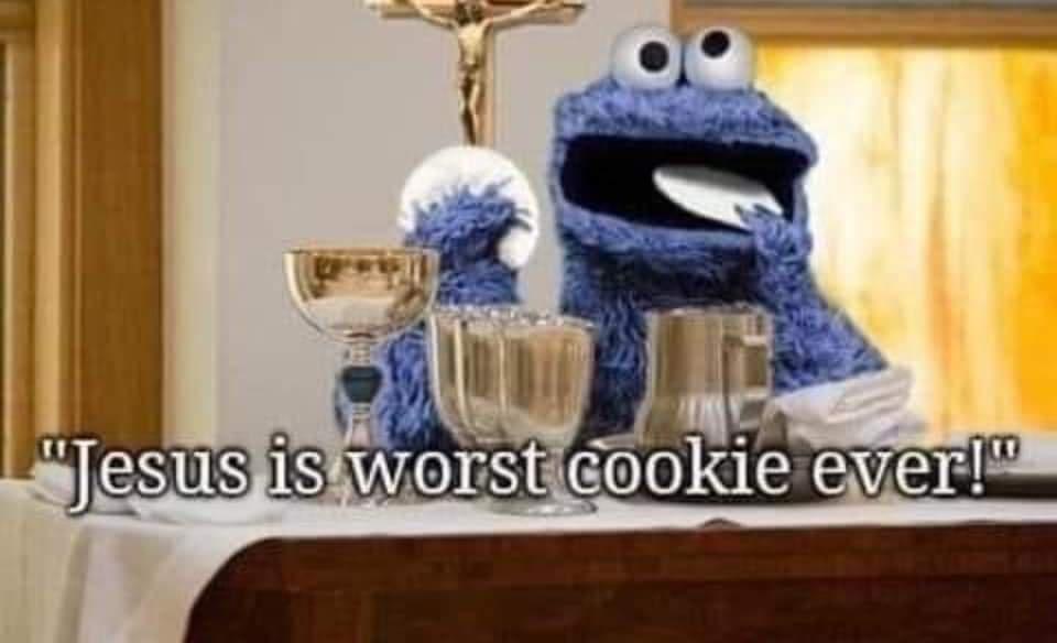 Cookie Monster sits at a church altar with communion cups and a crucifix behind him, holding a white plate to his mouth as…