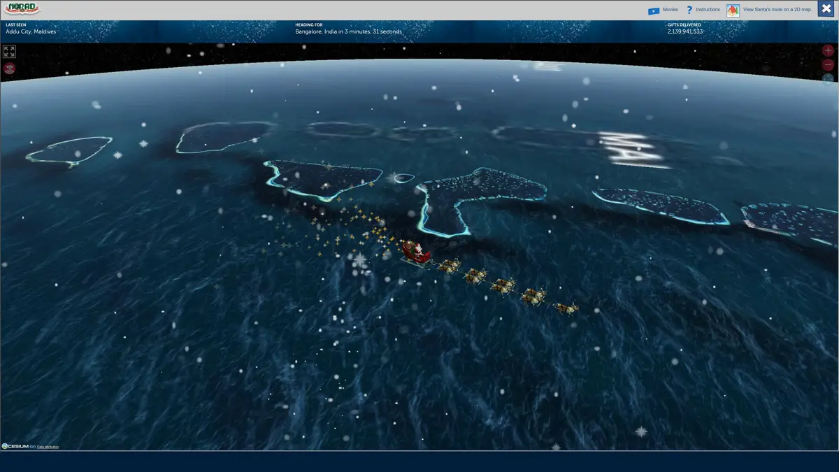 A screenshot from NORAD's Santa Tracker website shows Santa's sleigh flying over the Maldives, with text indicating he is…