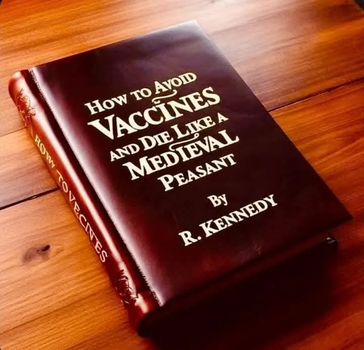 A dark brown leather-bound book with gold lettering lies on a wooden floor. The cover reads 'How to Avoid Vaccines and Die…