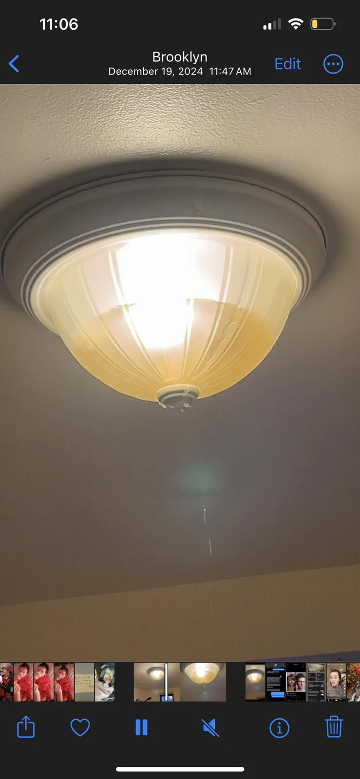A photo of a lit ceiling light fixture with a visible drip of liquid falling from its bottom, overlaid with the text 'i just…
