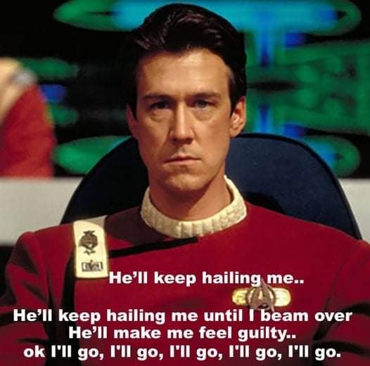 A still image of Captain Jean-Luc Picard from Star Trek: The Next Generation, wearing his red command uniform and sitting in…