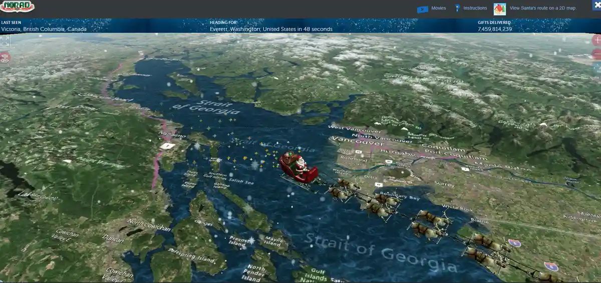 A screenshot from the NORAD Tracks Santa website shows Santa's sleigh flying over the Strait of Georgia, with overlaid text…
