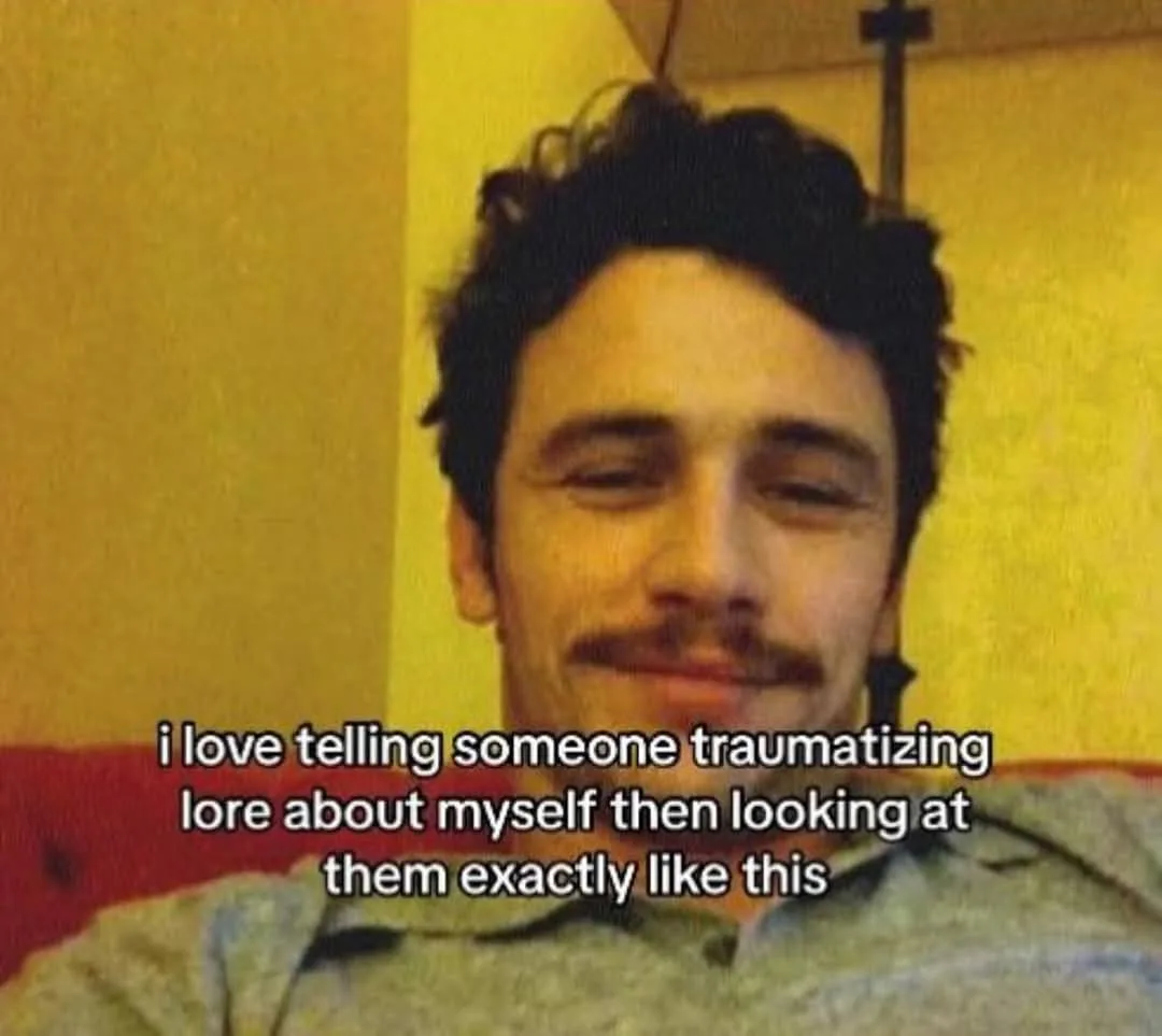A man with dark curly hair and a mustache is shown with his eyes half-closed and a smug, self-satisfied smirk. He wears a…
