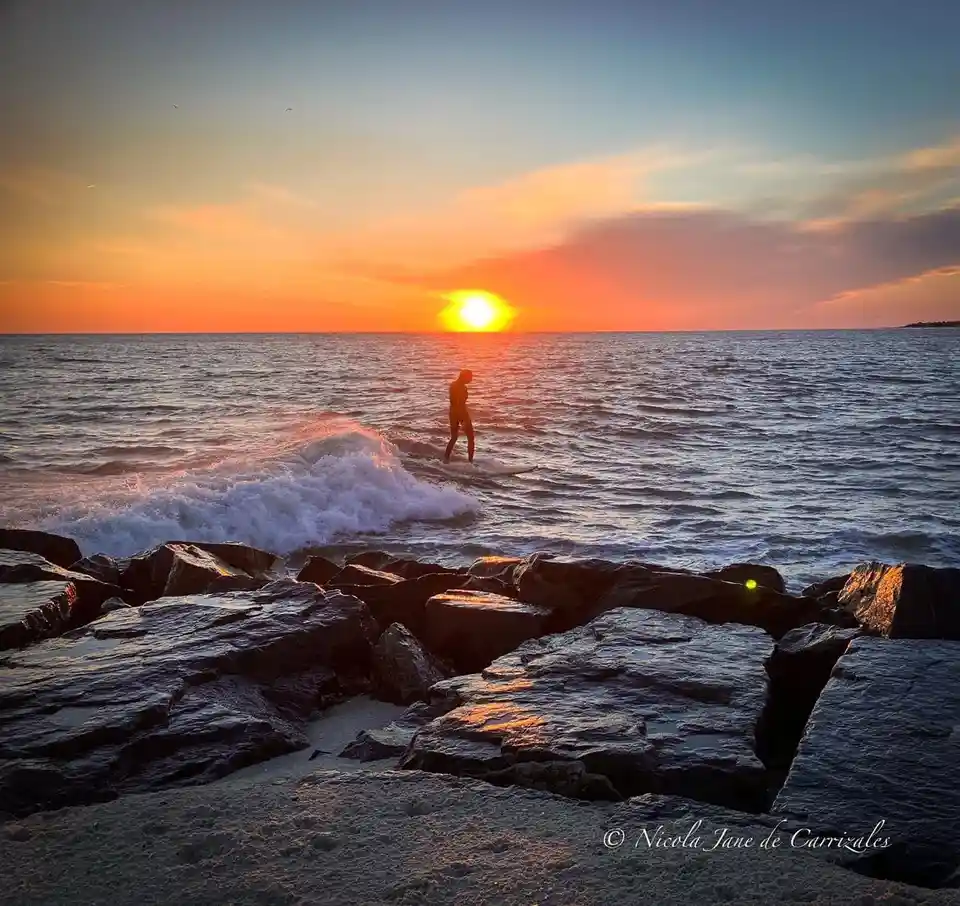 Catch the Waves: A Beautiful Sunset Surf Moment