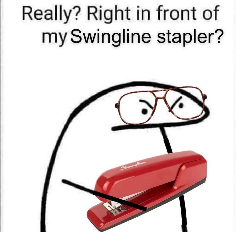 A red Swingline stapler is drawn with a stick-figure body and a pair of glasses, looking annoyed. The text above reads…
