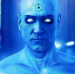 A blue-skinned, bald man with glowing white eyes and a targeting reticle drawn on his forehead stares intensely forward. The…