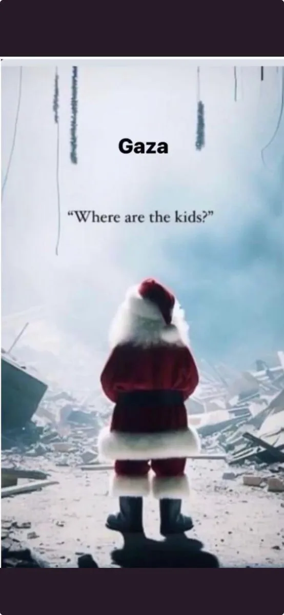 A person in a full Santa Claus outfit, viewed from behind, stands in a devastated urban landscape filled with rubble and…