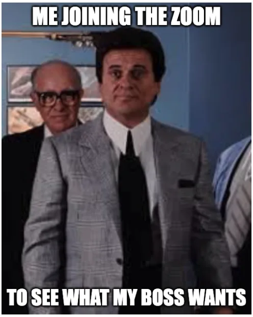 A still from the movie 'The Godfather' shows a man in a grey suit and black tie standing center frame with a serious…