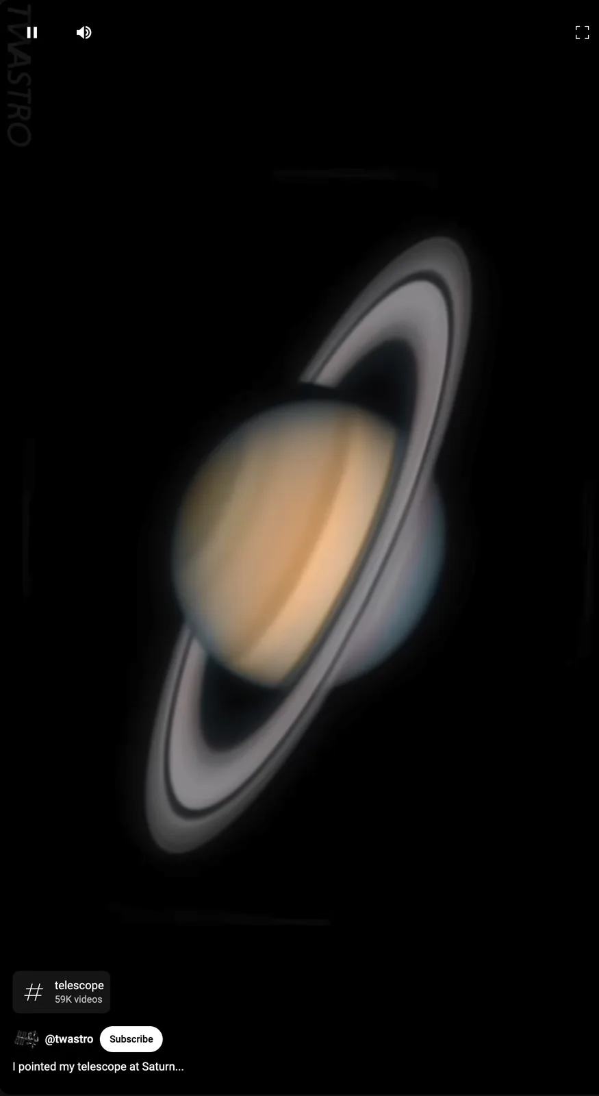 A blurry, motion-blurred image of the planet Saturn with its rings, set against a black background. The overlaid text reads…