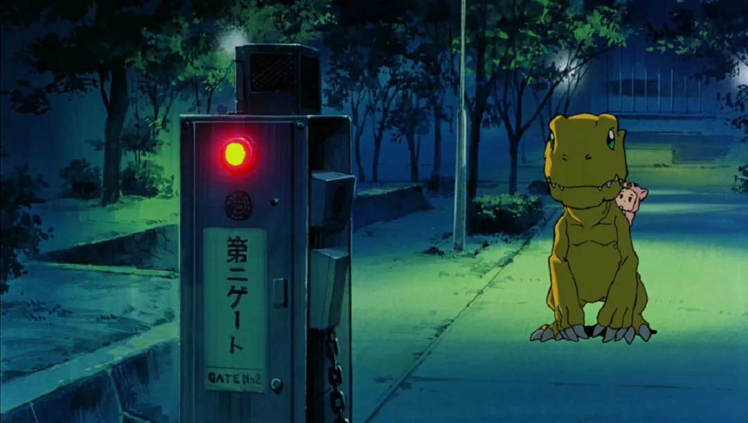 A still from the anime 'Digimon Adventure' shows a large yellow dinosaur-like Digimon, Agumon, sitting on a sidewalk at…