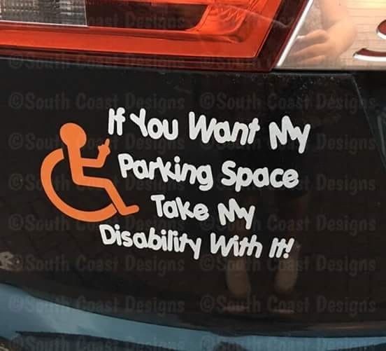 A black car bumper sticker features an orange wheelchair symbol and white text that reads 'If You Want My Parking Space Take…