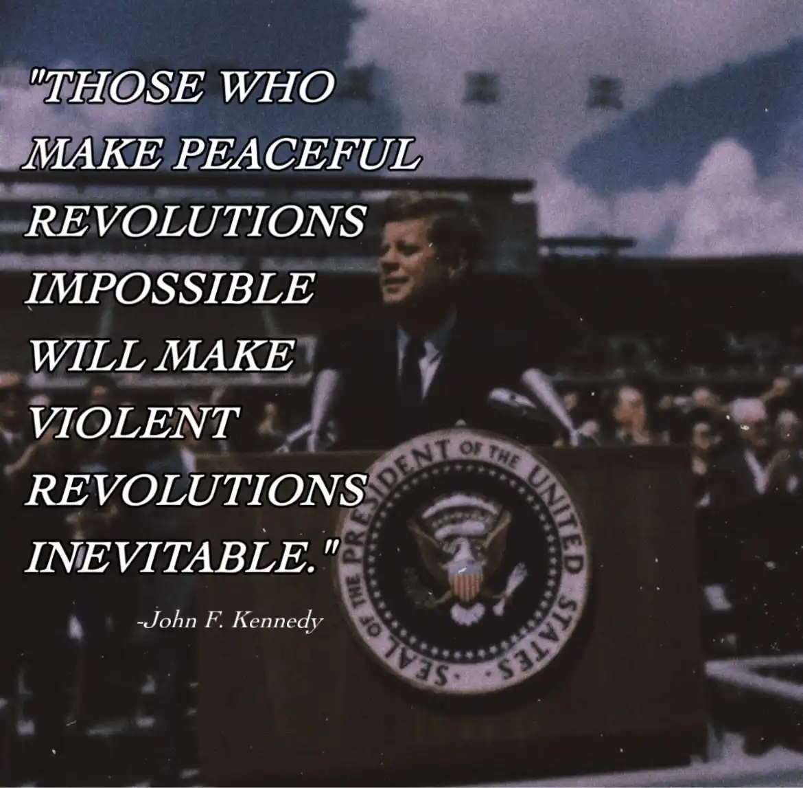 A vintage photo of John F. Kennedy speaking at a podium bearing the Seal of the President of the United States. Large white…