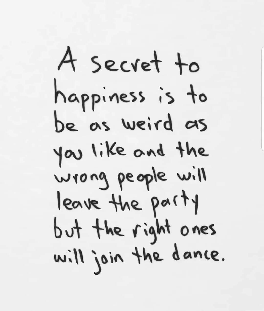 The image displays handwritten text in black ink on a plain white background. The text reads: 'A secret to happiness is to…