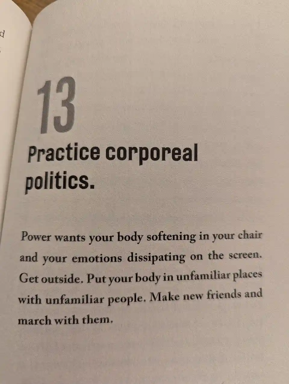 A close-up photo of a book page showing section 13 titled 'Practice corporeal politics.' The text advises readers to get…