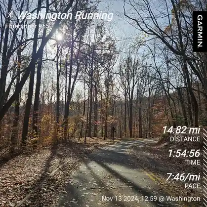 A screenshot of a Garmin Forerunner 955 running watch displaying a 14.82-mile run completed in 1 hour 54 minutes and 56…