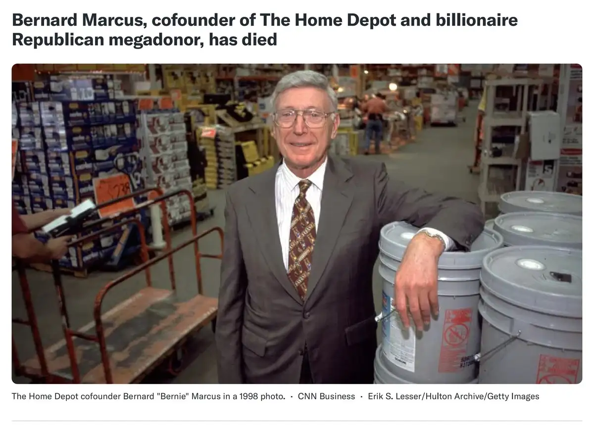 A 1998 photo shows Bernard 'Bernie' Marcus, co-founder of The Home Depot, smiling in a store aisle while leaning on a stack…