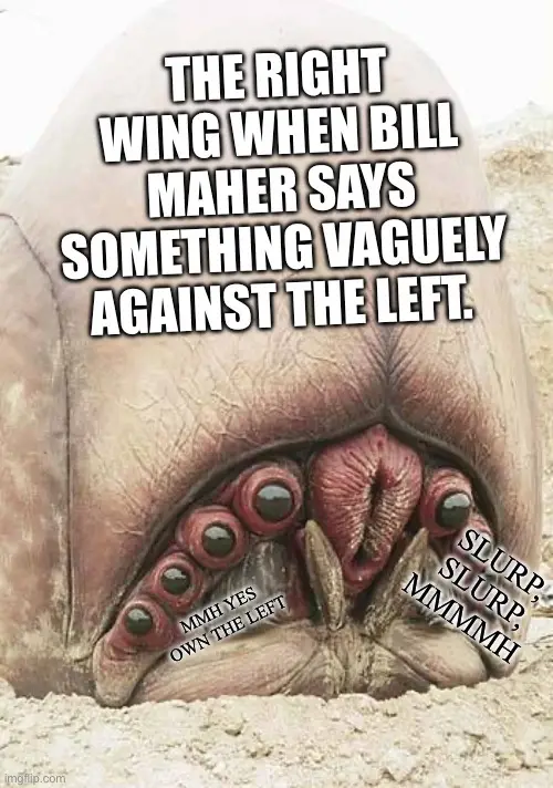 A close-up image of a giant, fleshy, worm-like creature with multiple red, bulbous eyes and a wide mouth, partially buried…