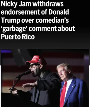 A man wearing a red 'NICKY JAM' cap stands at a podium speaking into a microphone, gesturing with his right hand. To his…