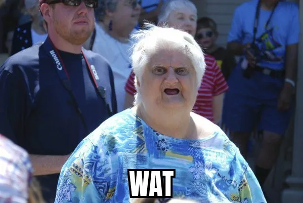 A close-up photo of an older woman with white hair and a surprised facial expression, wearing a blue floral shirt. The word…