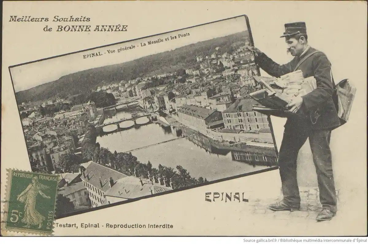 A vintage French postcard shows a mail carrier holding a large postcard of Epinal, featuring the Moselle river and bridges…