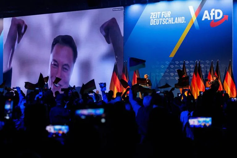 Elon Musk makes a surprise appearance at a German election campaign event - someone give that photographer a medal!
