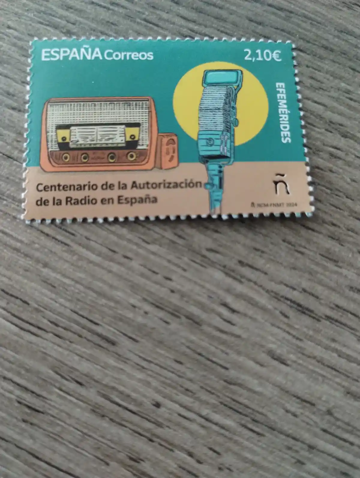 A Spanish postage stamp from ESPAÑA Correos commemorating the centenary of radio authorization in Spain, featuring a vintage…
