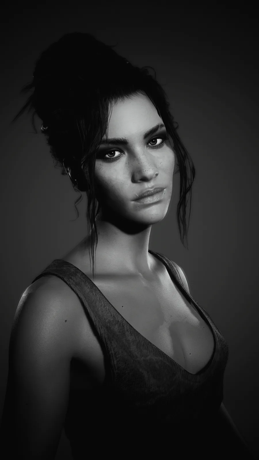 A black-and-white portrait of a woman with dark hair pulled back, looking directly at the camera with a serious expression…