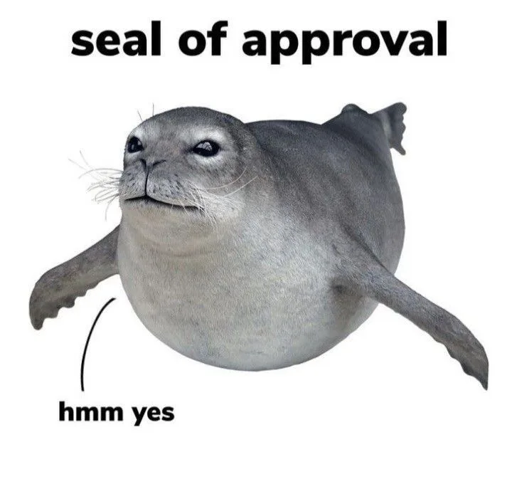 A gray seal is shown with a smug, satisfied expression, looking upward. Text above reads 'seal of approval,' and below, an…